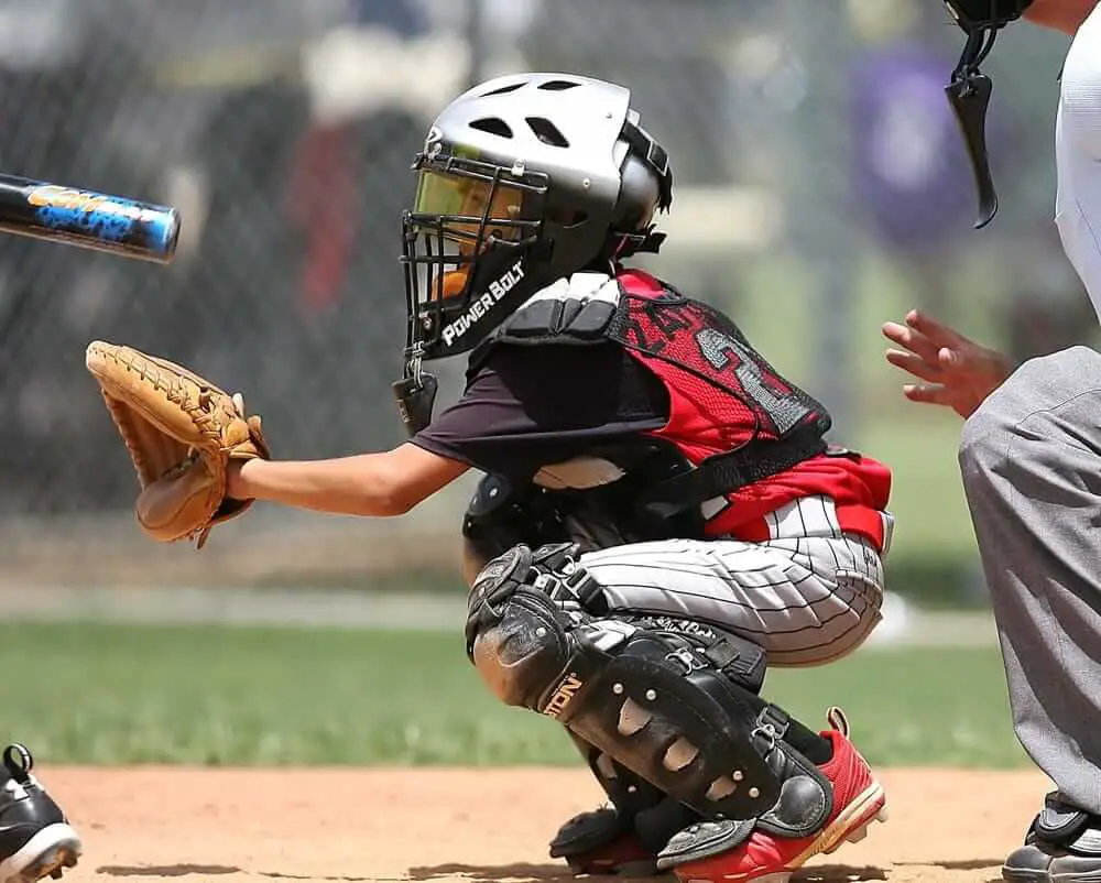 Youth Catcher in position, wearing knee savers