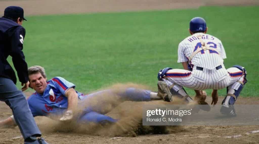 Ron Hodges catching as Pete Rose slides