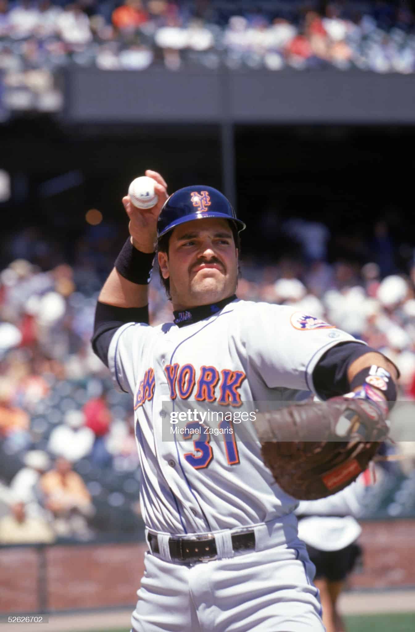 Former New York Mets catcher Mike Piazza warming up before a game against the Giants in San Francisco