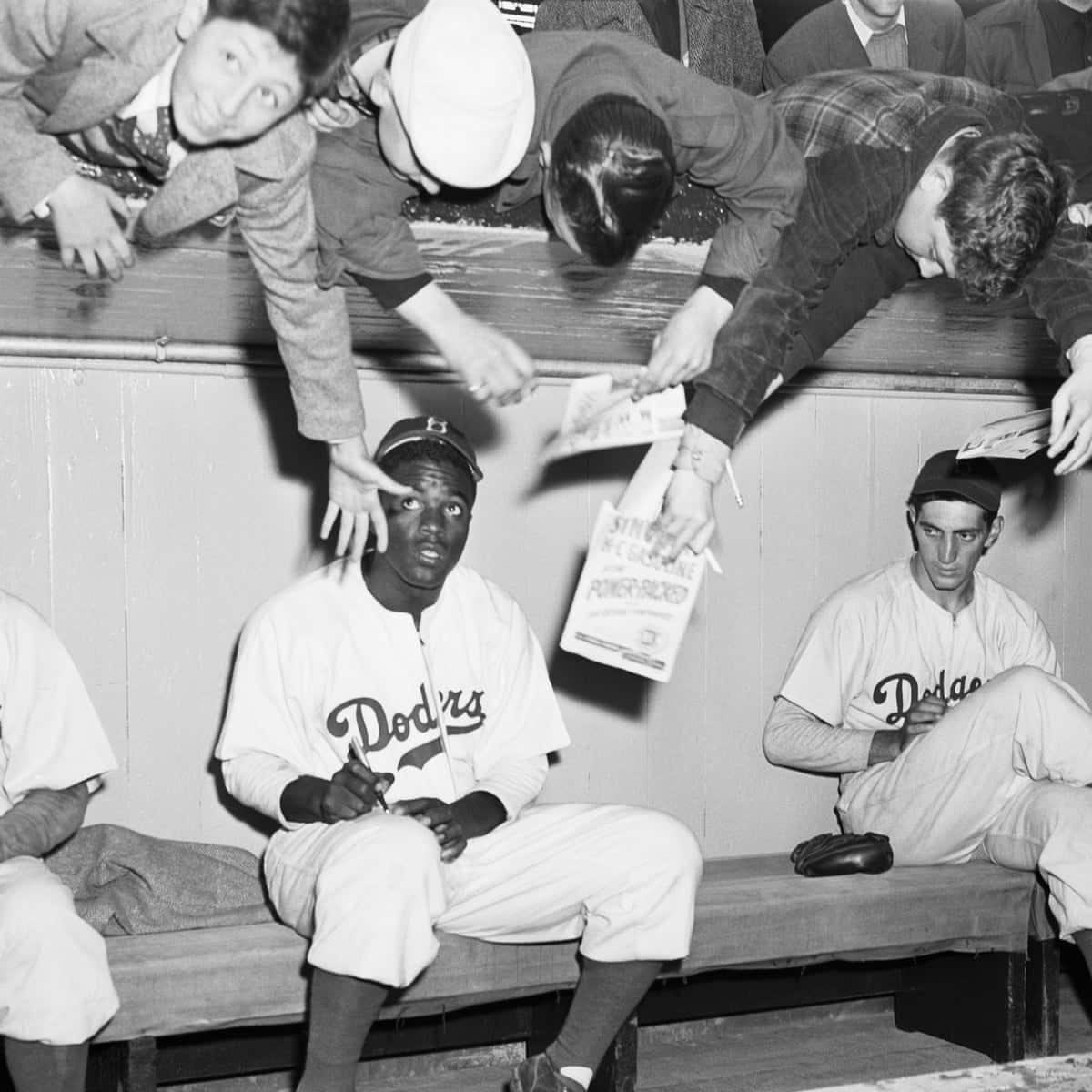 Jackie Robinson signing autographs