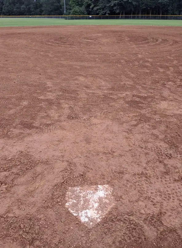dirty home plate wet softball field